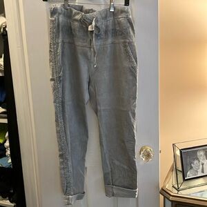 NT pull on one size grey jean. Embellished sides (silver)
